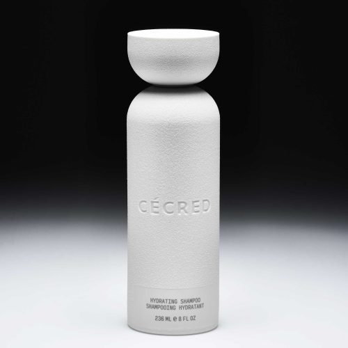 Hydrating shampoo bottle against black and white background